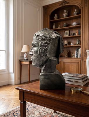 a bust of a man sitting on a table in a living room