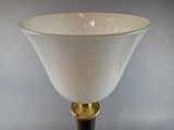a lamp that is sitting on a table next to a wall