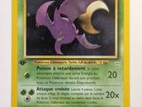 a close up of a pokemon card with a purple dragon on it
