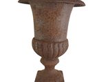 an old vase that is sitting on a stand