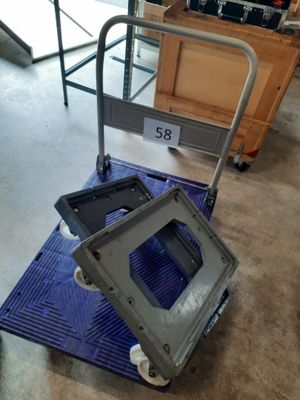 a dolly cart with a tv on it in a room
