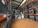 a large warehouse filled with lots of boxes and pallets