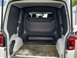 the back of a white van with its open doors open