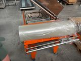 a machine that is sitting on a table in a warehouse