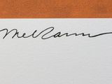 an image of a signed picture of a man in a suit and tie