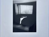 photograph of a black and white photo of a couch in a living room