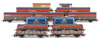 six train cars that are lined up on a white surface