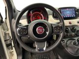 the interior of a small car with a steering wheel and dashboard