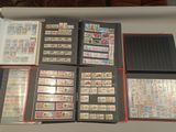 a lot of different stamps on a table together