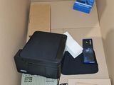 a box with a printer and other electronics inside of it
