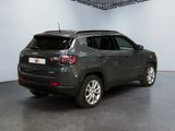 the jeep compass is parked in the garage of a building
