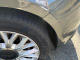 a close up of a car ' s tire on the street
