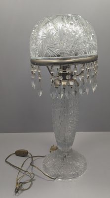 a lamp that is sitting on a table next to a cord