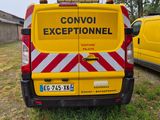 a yellow van that is parked in the grass