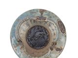an image of a ceramic bowl with a coin in the center