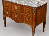 an antique chest of drawers with marble top and brass handles