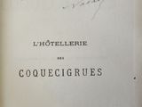 an old book with writing on it sitting on a table