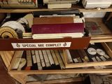 a drawer full of old typewriters and typewriters