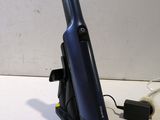 a cell phone on a stand with a charger attached