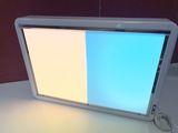 a computer monitor sitting on a desk with a mouse