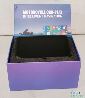 an image of a purple box with a black phone inside of it