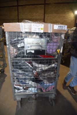 a metal cart with many items in it in a warehouse