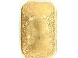 a small square shaped gold piece on a white surface