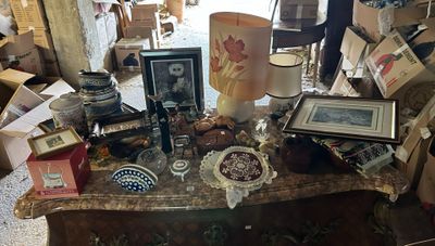 a table with many items on it in a room