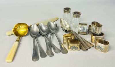 a lot of silver spoons and silverware on the table