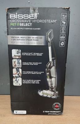 the box of the bissell vacuum is open on the table