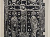 an old black and white photo of a door with a crucifidus on it