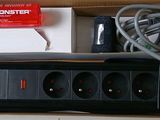 a box that has a power strip and a cord in it