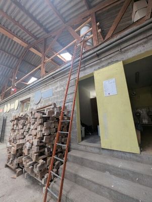 a ladder that is leaning up against a building