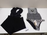 two pieces of clothing sitting on top of a table next to each other