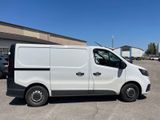 a white van parked in a parking lot with a blue sky in the background