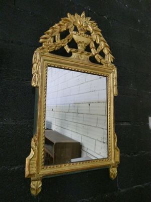 a mirror hanging on the wall in a room