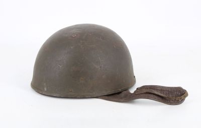 an old helmet with a brown cord on a white background