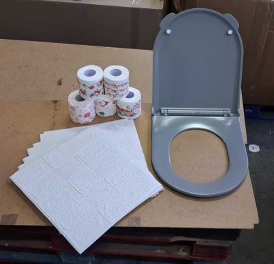 several rolls of toilet paper sitting on a table next to a toilet