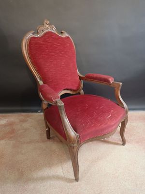 an old chair with red upholstered upholstered upholstered upholstered upholstered upholstered upholstered upholstered upholstered