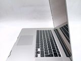 a close up of a laptop computer on a white surface