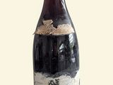 a bottle of wine that is sitting on a table