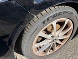 a close up of a tire on a black car