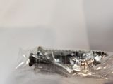 a toothbrush that is wrapped in plastic on a table