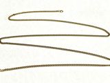 a close up of a chain on a white surface
