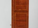 a wooden cabinet on wheels with a door on top