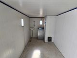 a room with a sink and a toilet in it
