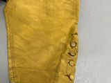 a close up of a pair of yellow pants on a table