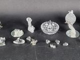 a lot of glass figurines sitting on a table