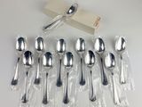 a lot of silver spoons and spoon spoons on the table