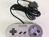 an image of a video game controller sitting on top of a table